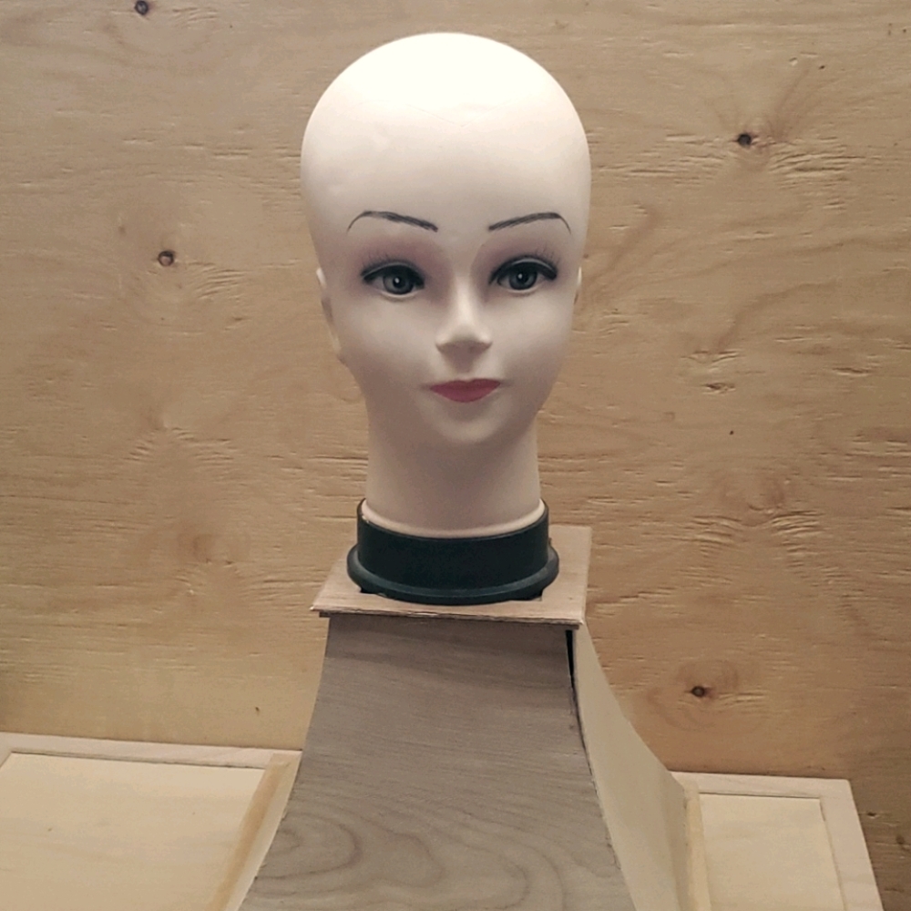 Antique hat making doll head.